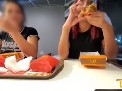 Two naughty girls making out with their breasts out while eating at McDonald's - Official Tattooed Angel