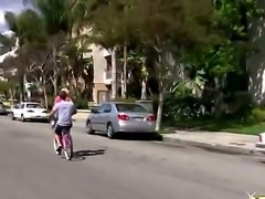 Young blond slut likes to ride a bike and then expose her pretty pussy to her...