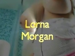 Lorna with her tits out preparing a bath