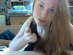 Hot redhead with pale skin fingers her tight pussy