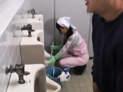 Asian bathroom attendant is in the mens
