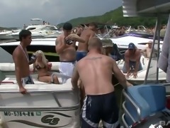 Sexalicious girls parting topless on a boat