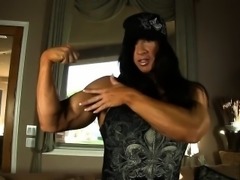 Beefy Milf shows us her muscles then her big clit