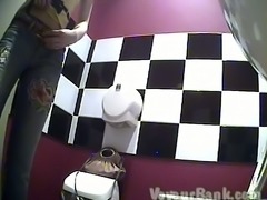 Blonde pale skin girl in the restroom dries her pussy
