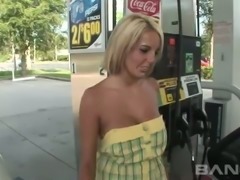 Sexy tanned short haired blondie exposes her big tits at the gas station